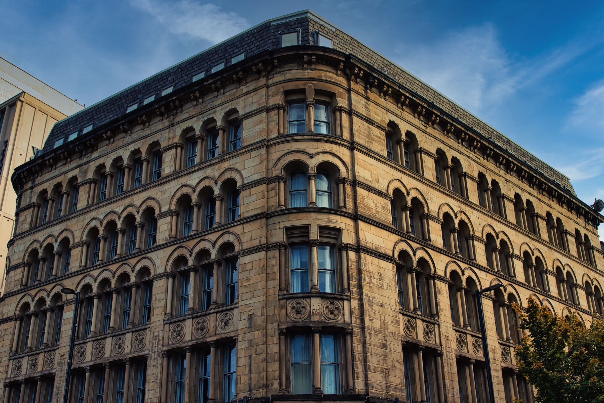 Arched Window Building with Ornate Stonework in Manchester